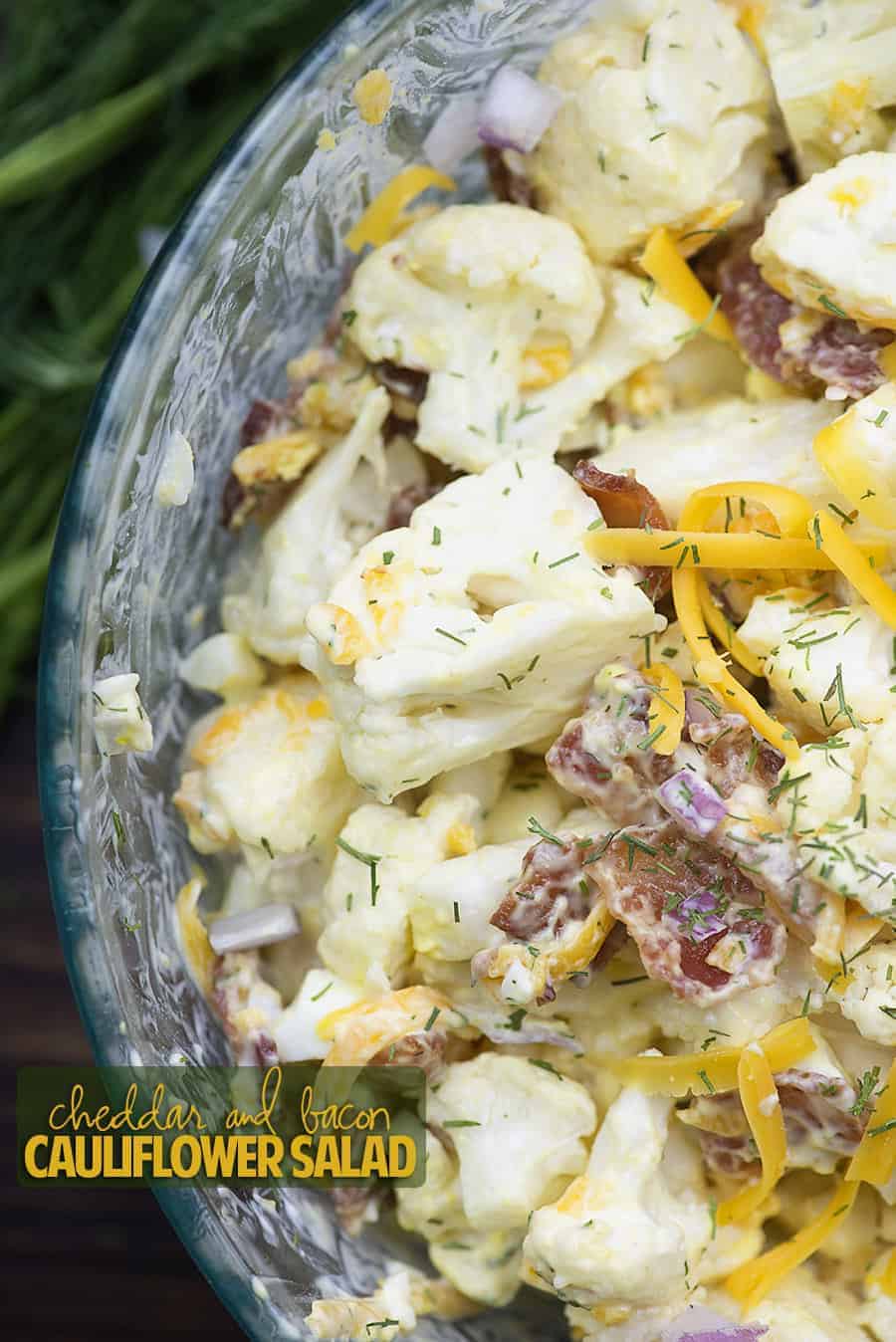 Cheddar and bacon cauliflower salid in a bowl.