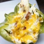 Bacon, chicken, and jalapeno popper dip fill these easy stuffed peppers!