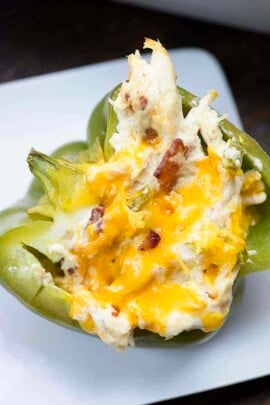 Bacon, chicken, and jalapeno popper dip fill these easy stuffed peppers!