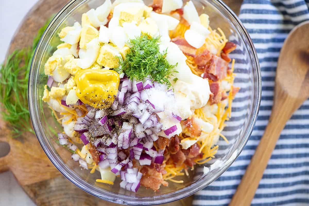 ingredients for cauliflower potato salad in mixing bowl.