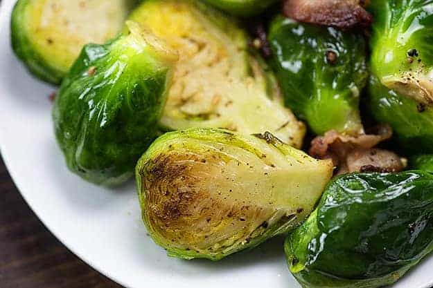 brussel sprouts and bacon on white plate