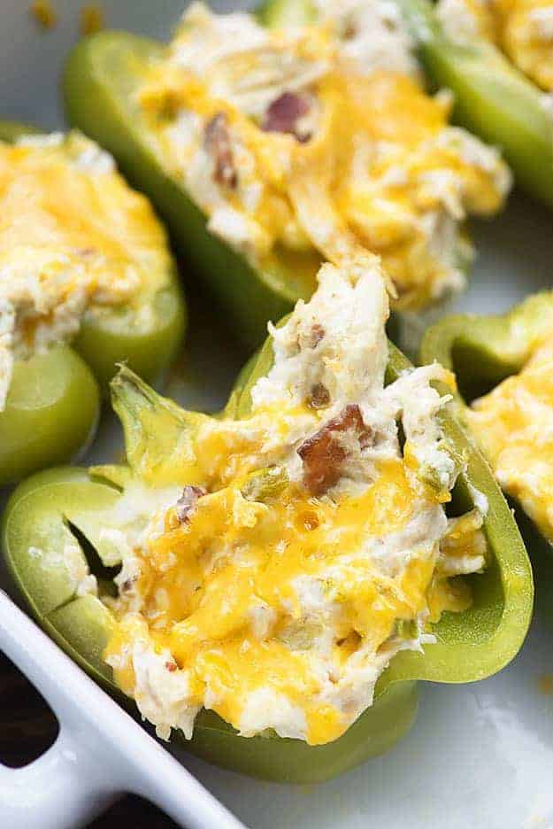 cream cheese stuffed peppers in white baking dish