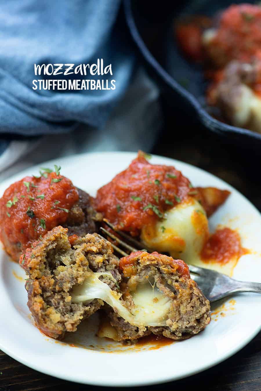 mozzarella stuffed meatballs on white plate