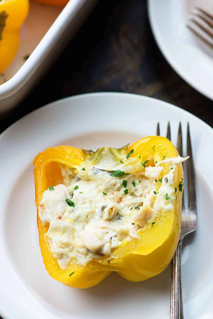 chicken stuffed peppers on white plate