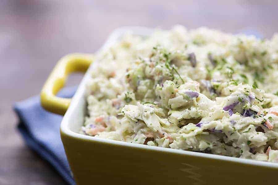 healthy coleslaw in yellow bowl