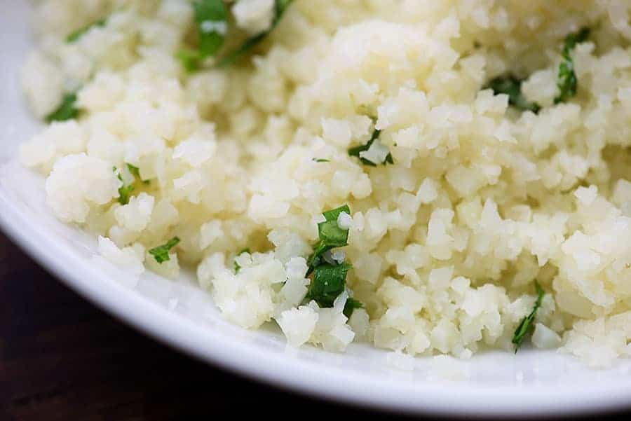 cooked cauliflower rice in white bowl