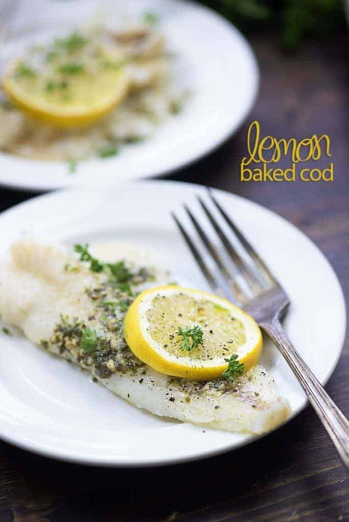 lemon baked cod on white plate
