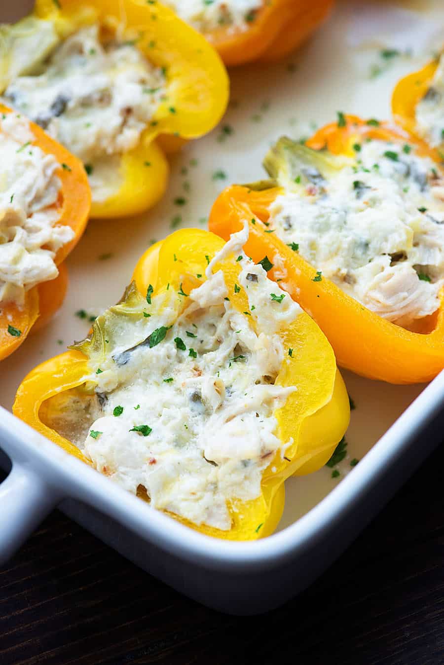 low carb stuffed peppers in white baking dish