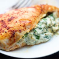 spinach stuffed chicken on plate