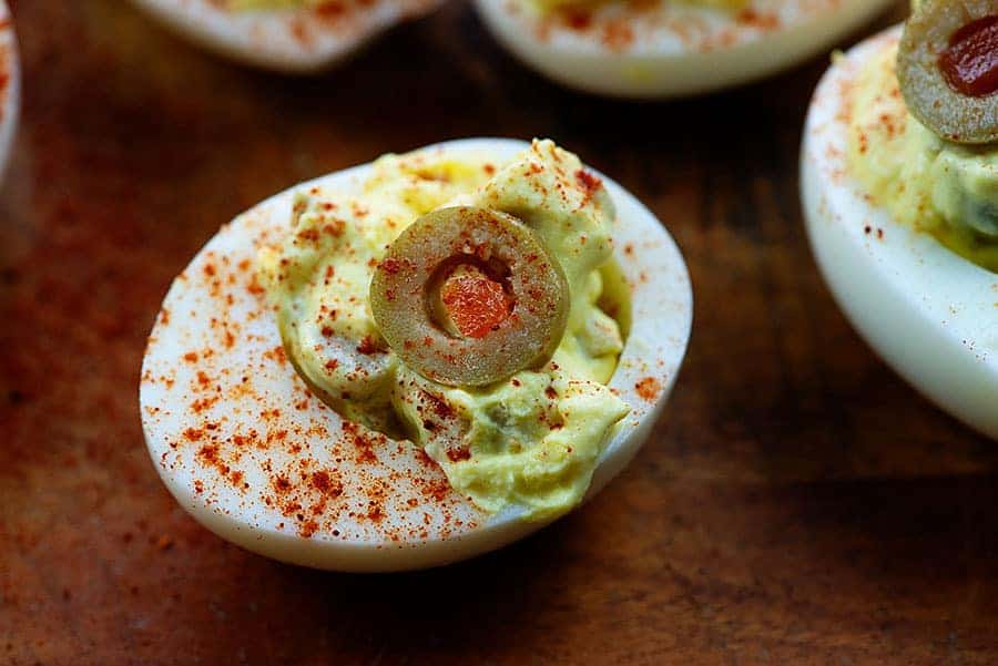 healthy deviled eggs on cutting board