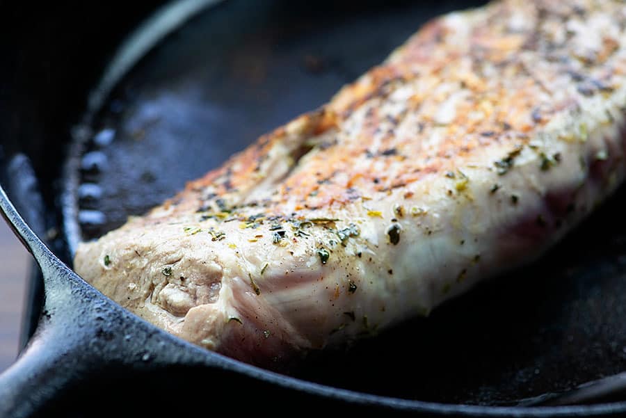 seared pork tenderloin in skillet