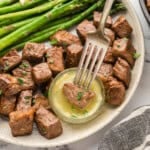 Garlic butter steak bites on plate.