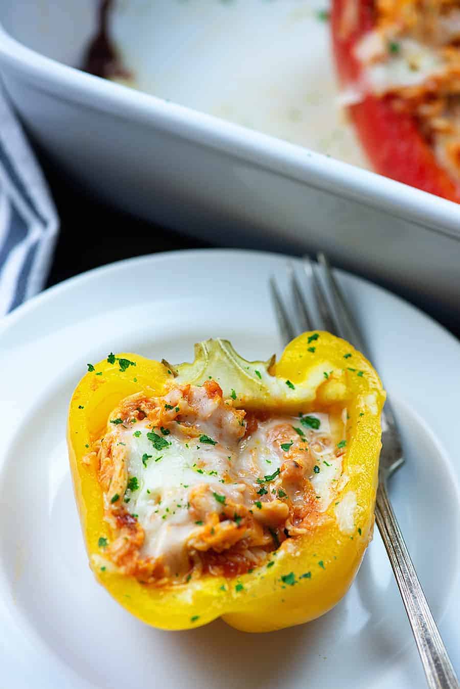 chicken stuffed peppers on white plate