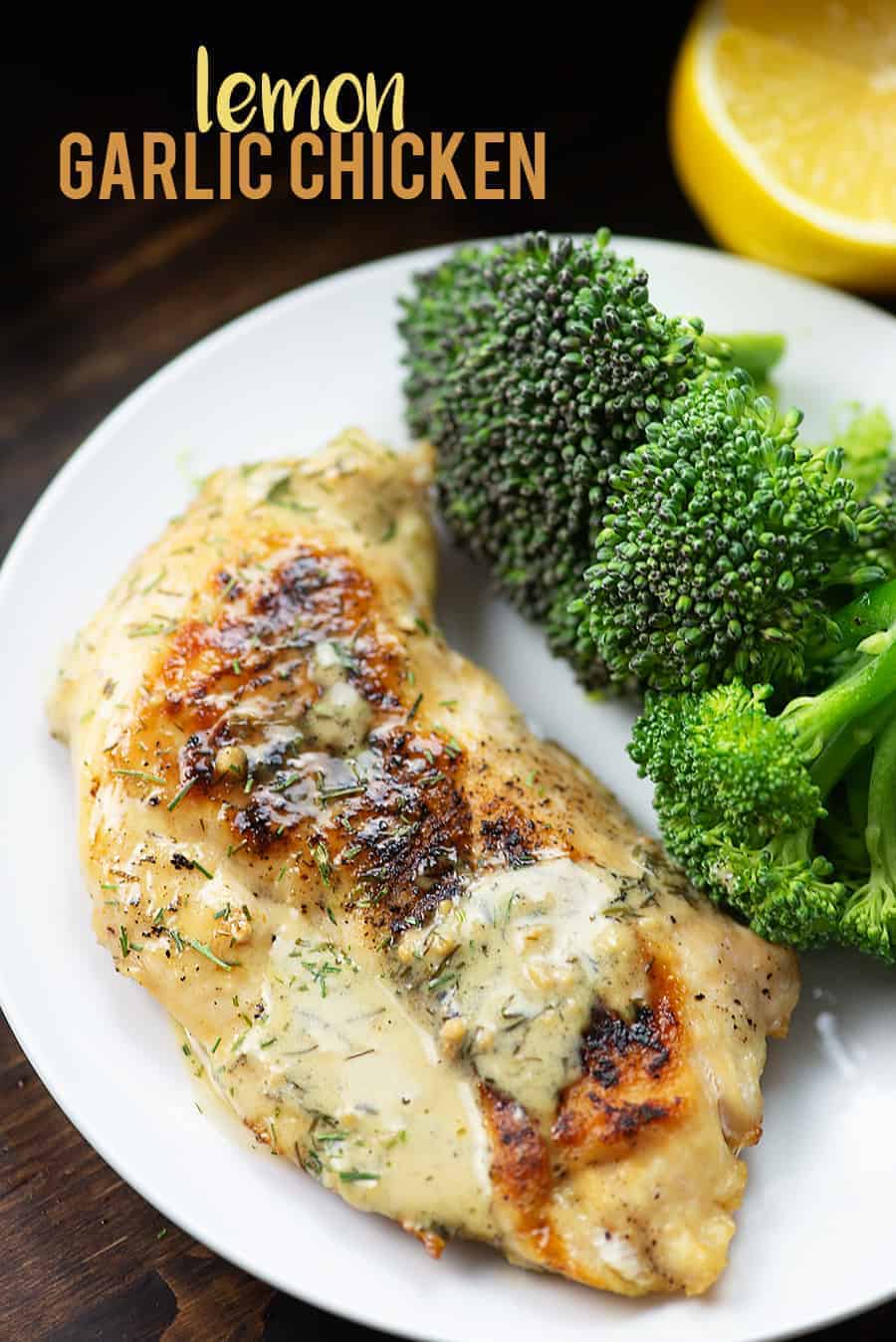 A plate of lemon chicken next to large broccoli pieces