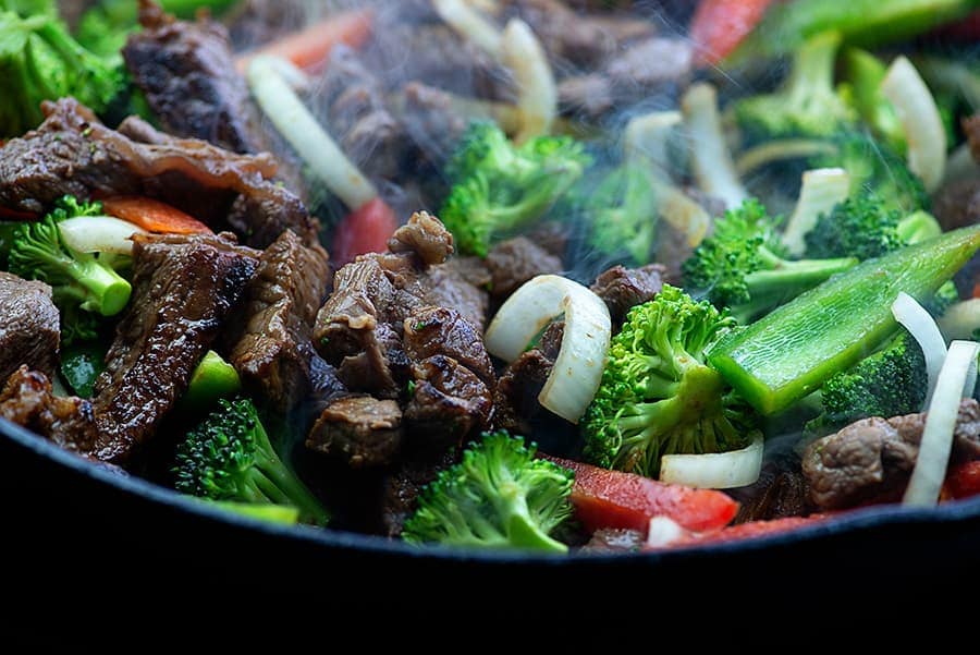 keto stir fry simmering in cast iron skillet