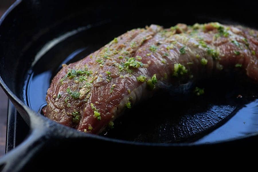 marinated pork tenderloin in cast iron skillet