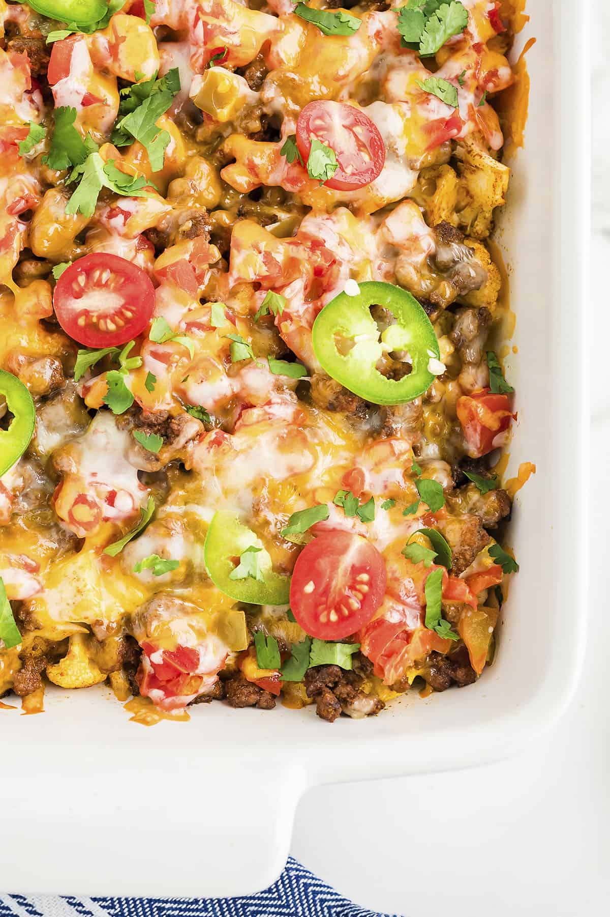 taco bake with cauliflower on white plate