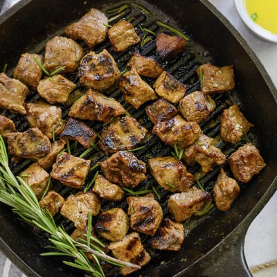 Grill pan full of steak bites.