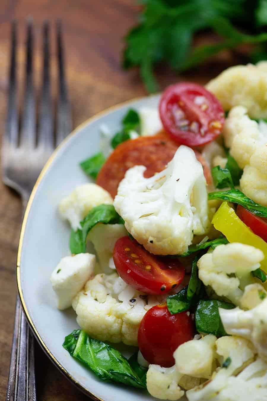 cauliflower salad recipe on white plate