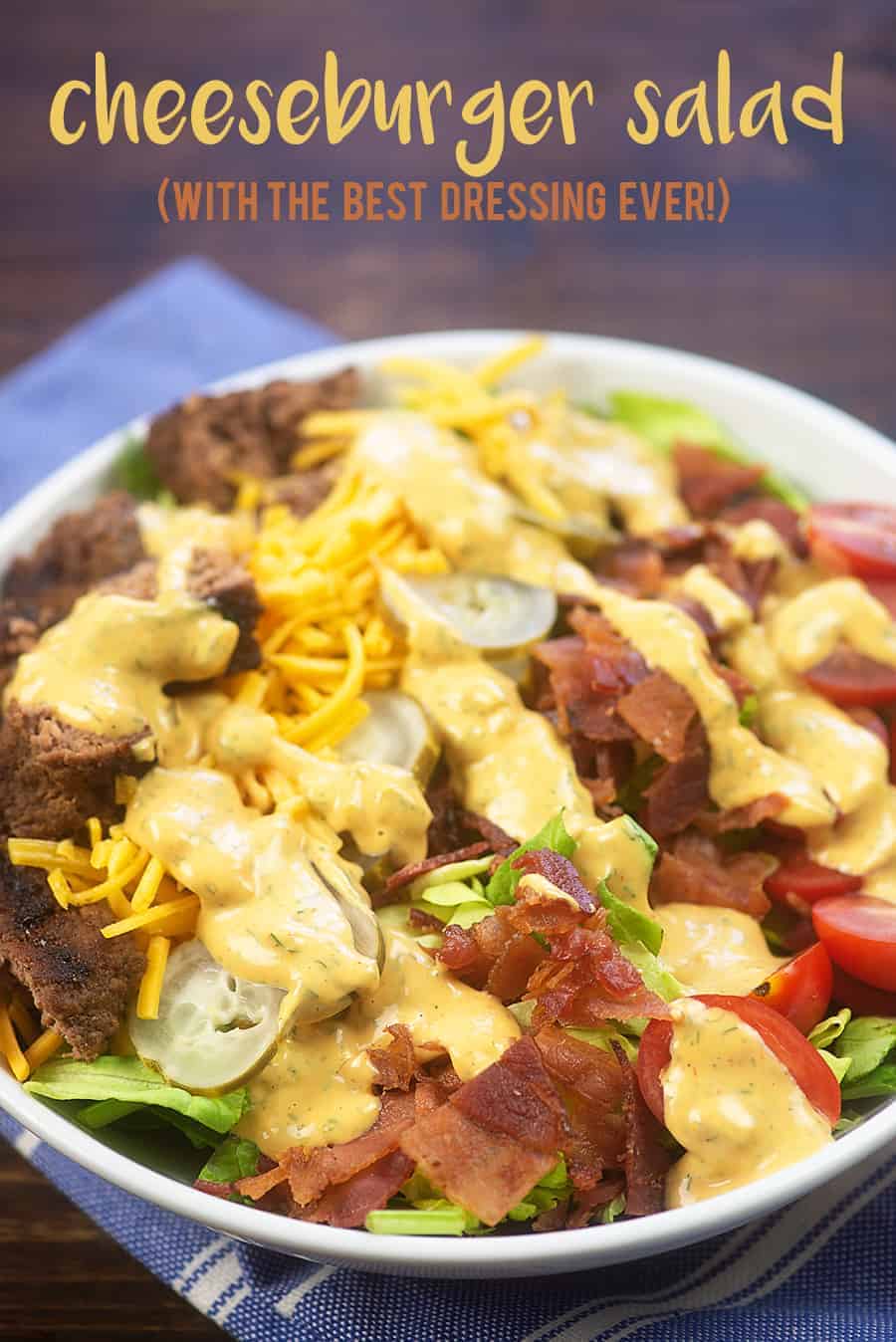 Cheeseburger salad in a white bowl.