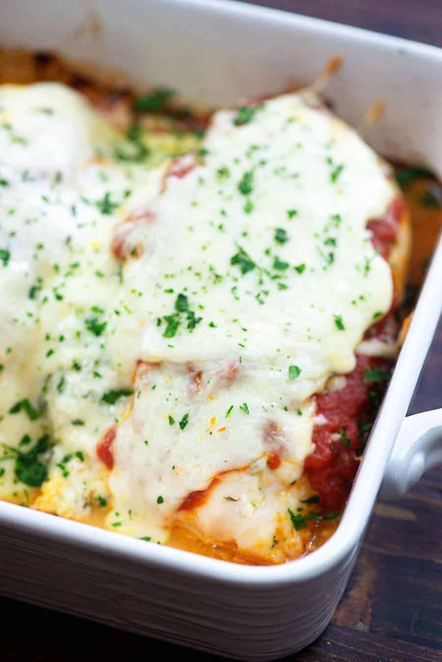 Cooked lasagna in white pan