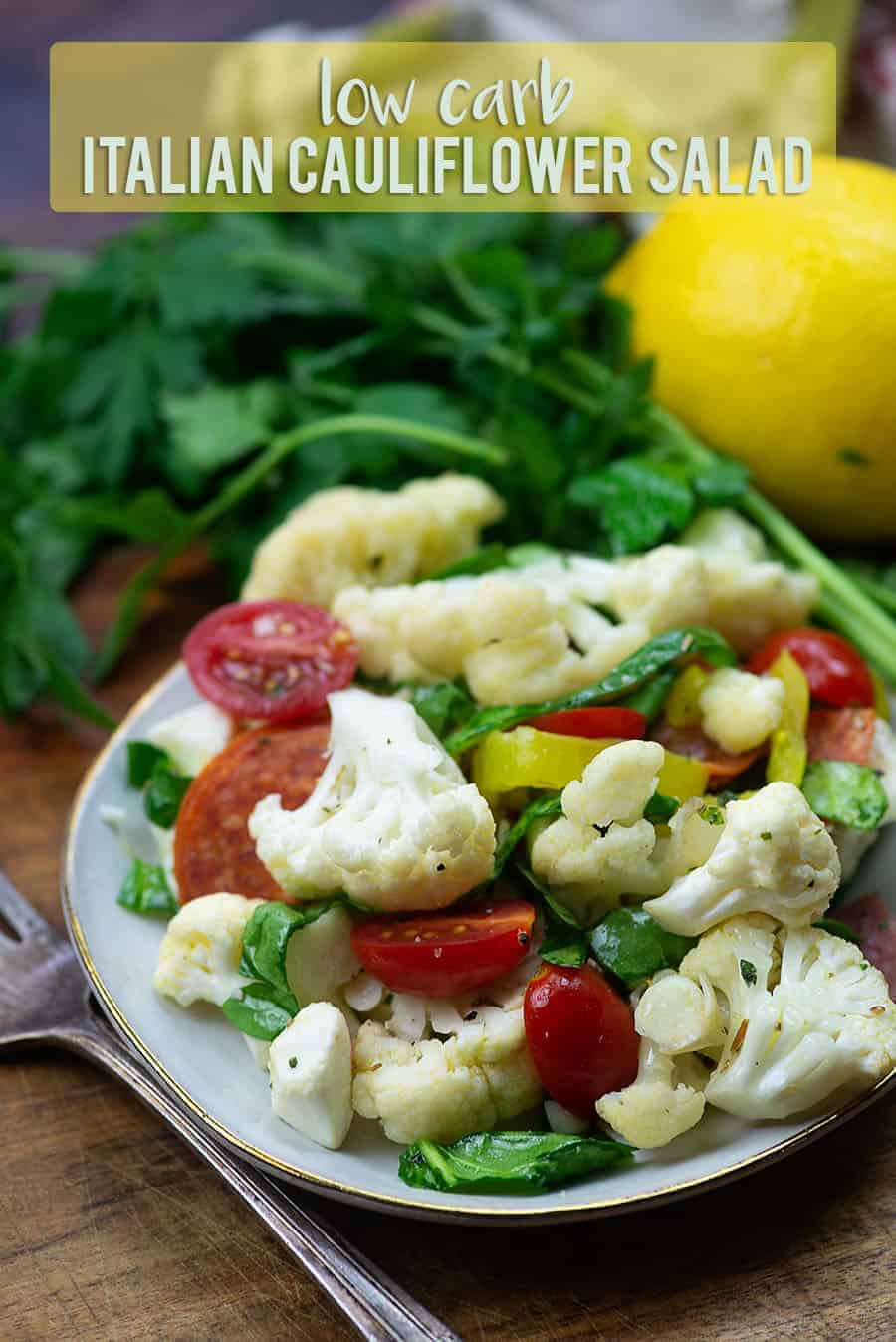 Caulflower salad ingredients on white plate