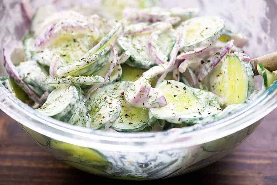 German cucumber onion salad in glass bowl
