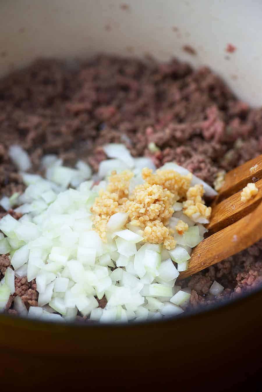 ground beef with onions in pan