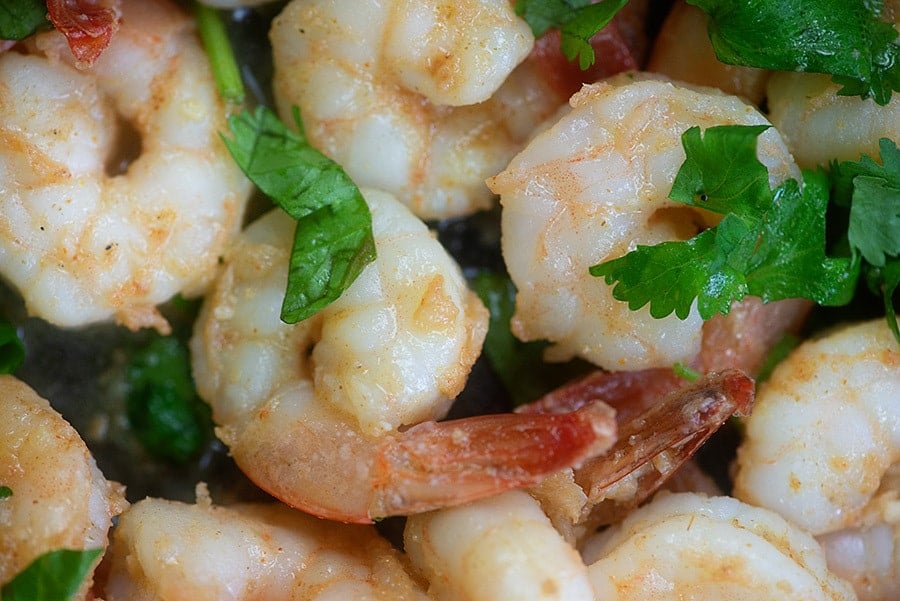 shrimp in skillet with lime and cilantro