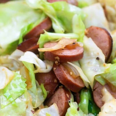 A close up of Cabbage and Sausage mixed together