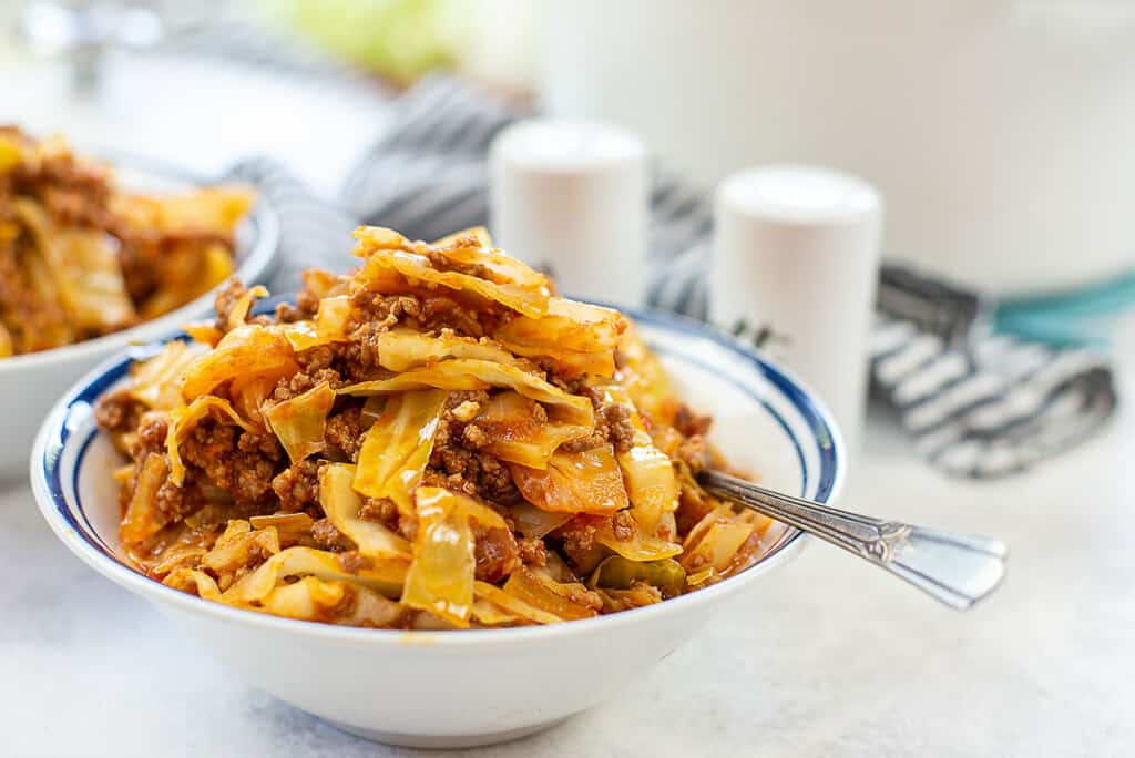 unstuffed cabbage rolls in white bowl.