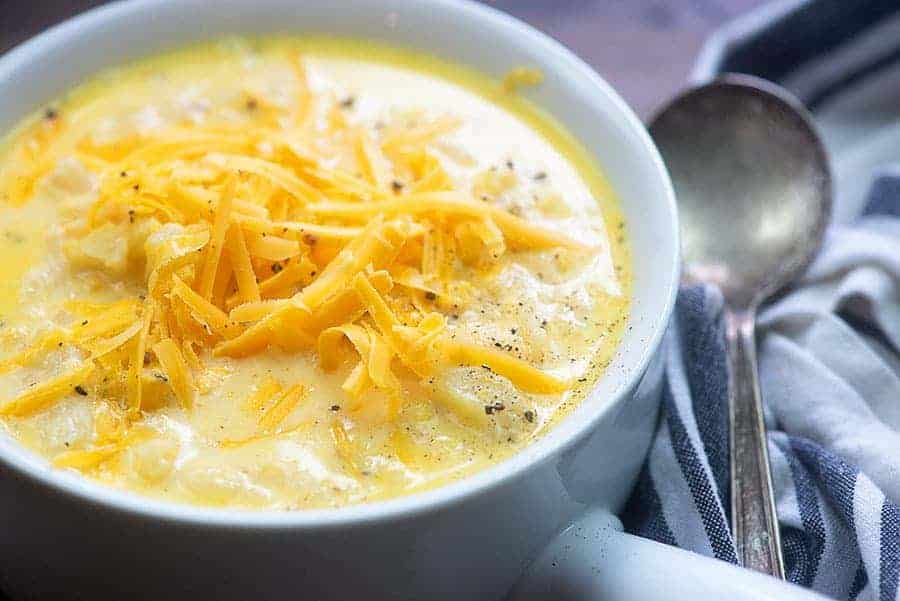healthy cauliflower soup in white bowl
