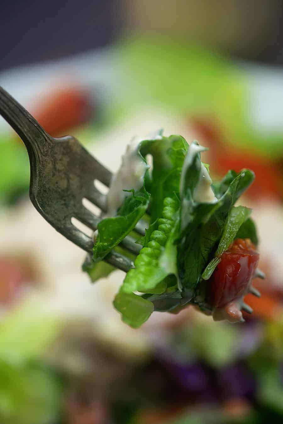 fork of lettuse with thousand island dressing