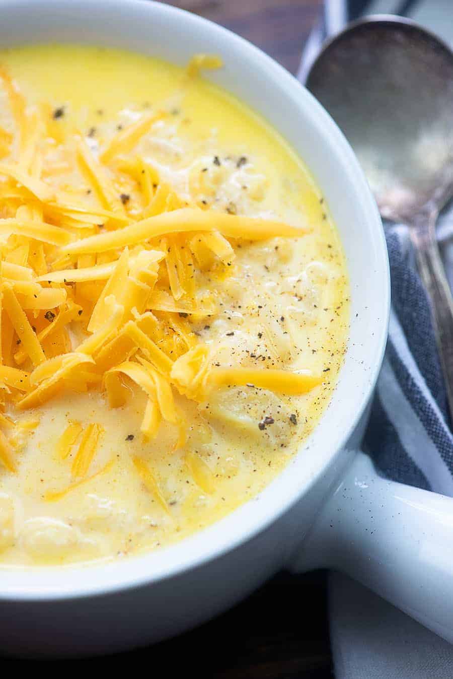 A close up of a bowl of food, with Soup