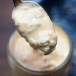 spoon full of thousand island dressing over a jar