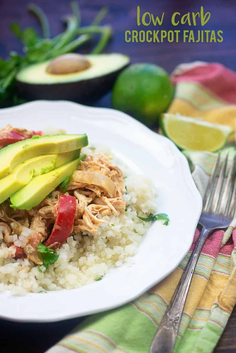 diced cauliflower, chicken, and avocado slices on a small white plate