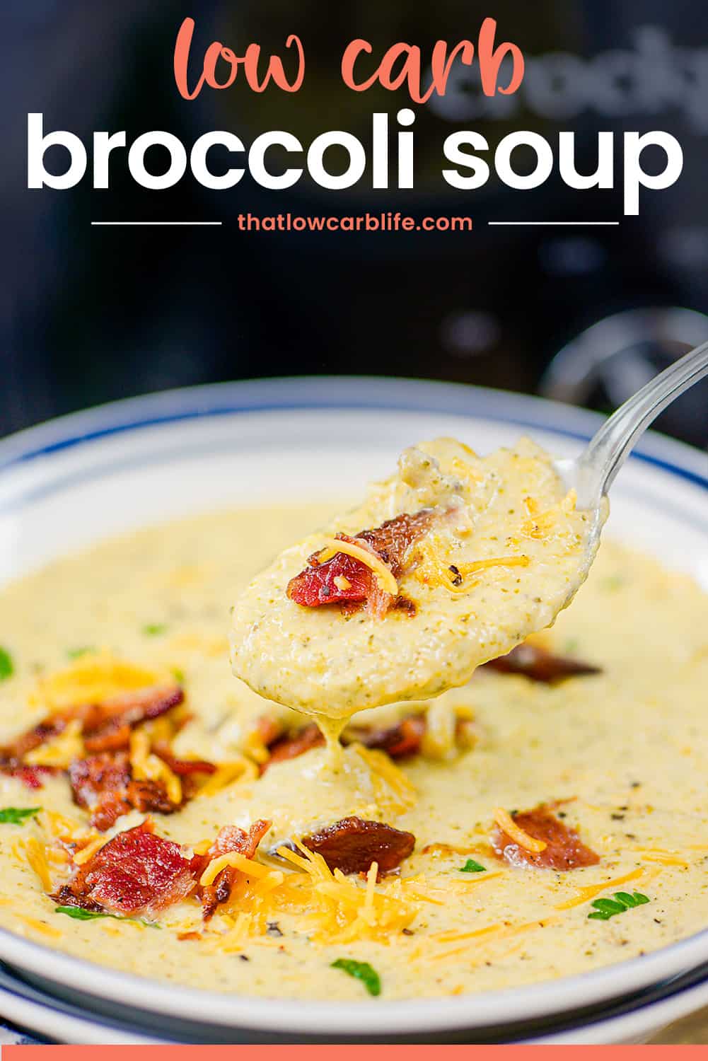 Broccoli cheese soup on spoon.