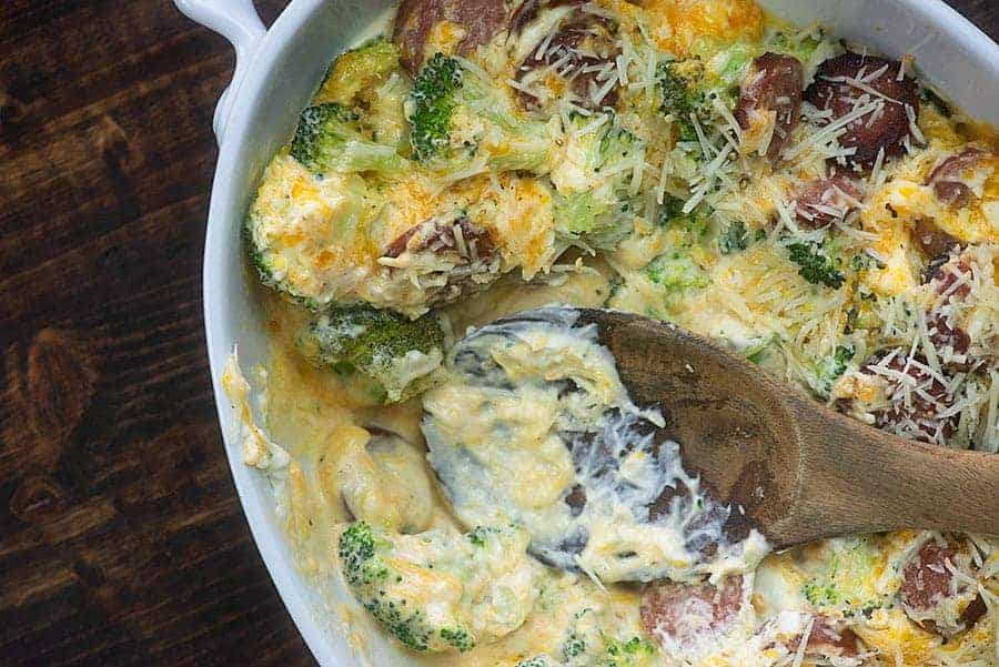 broccoli cheddar casserole in white dish