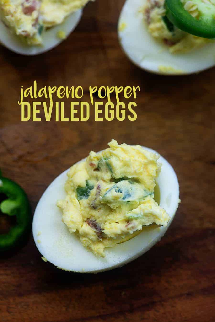 jalapeno popper deviled eggs on a cutting board