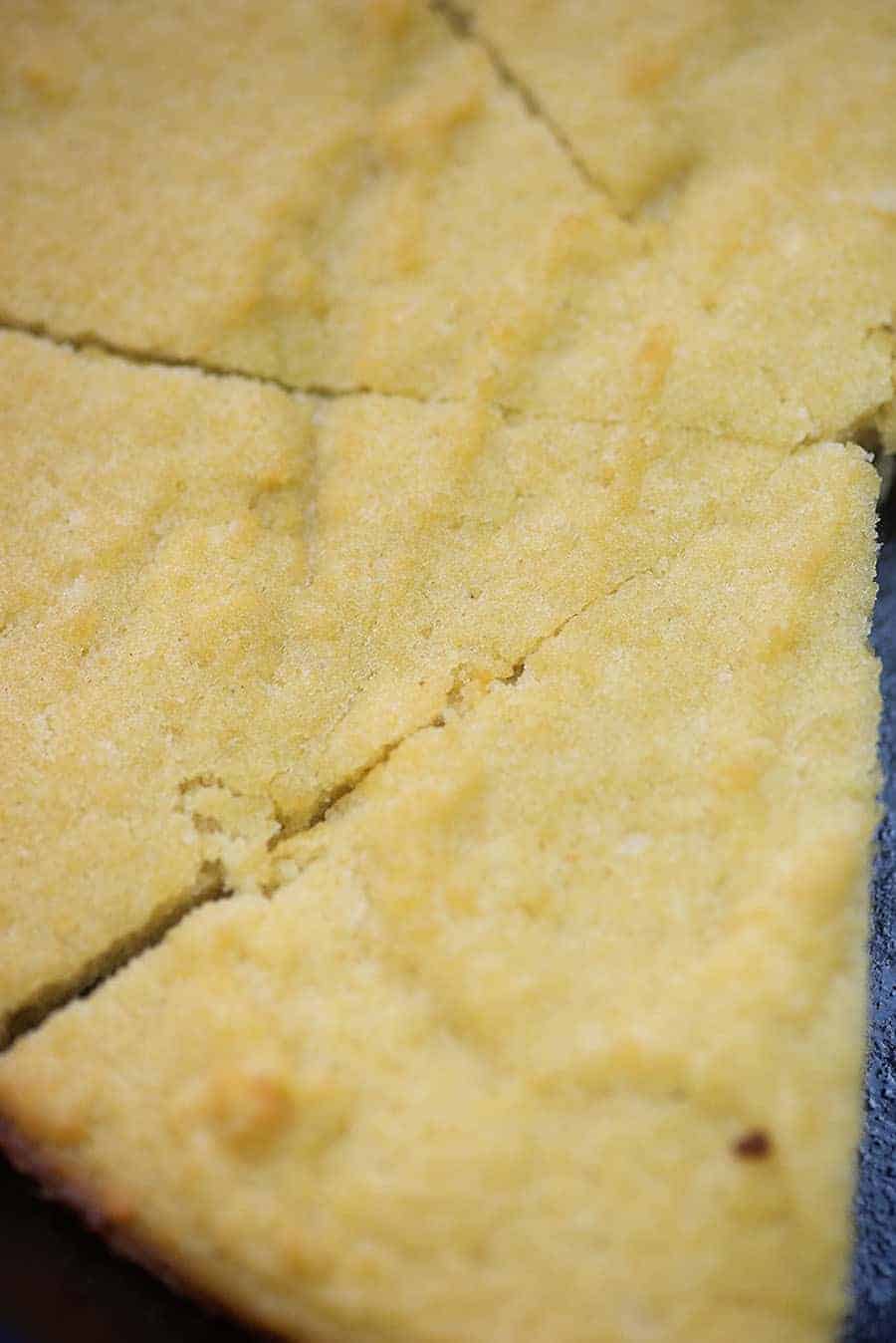 A close up of low carb cornbread cut into triangle pieces