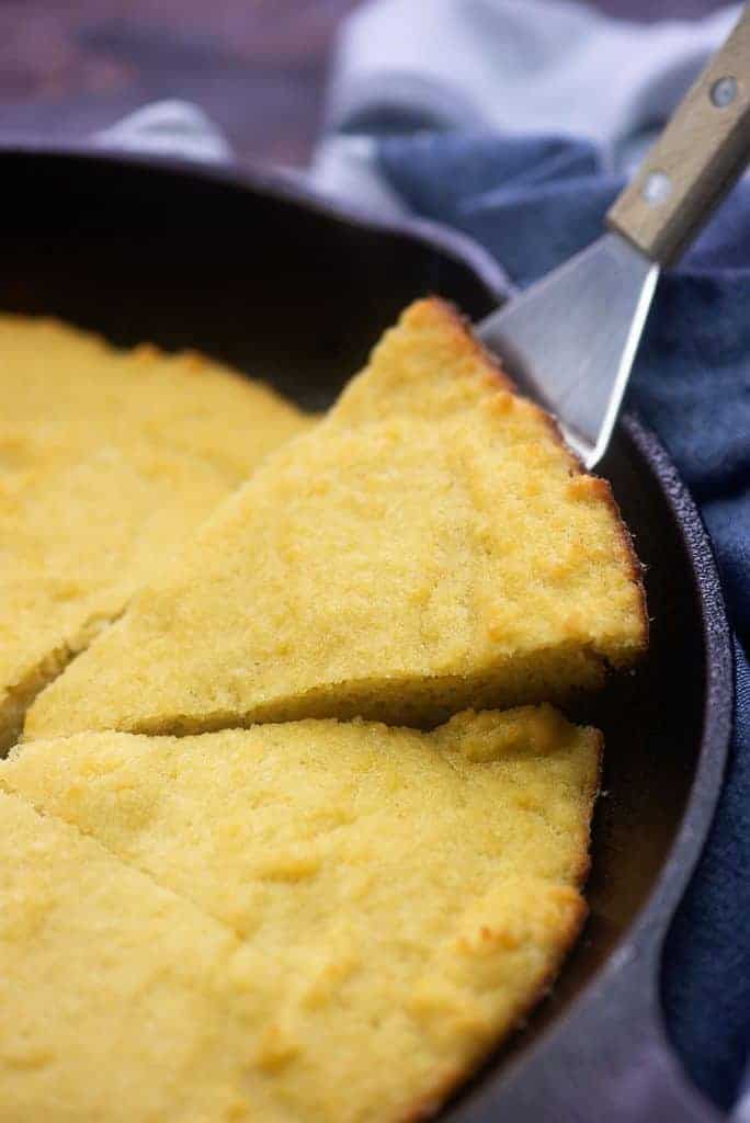 A bowl of food, with Cornbread