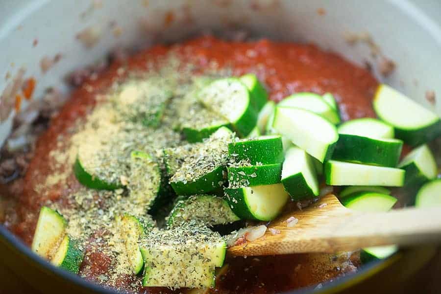 stirring the ingredients of low carb goulash in a pot