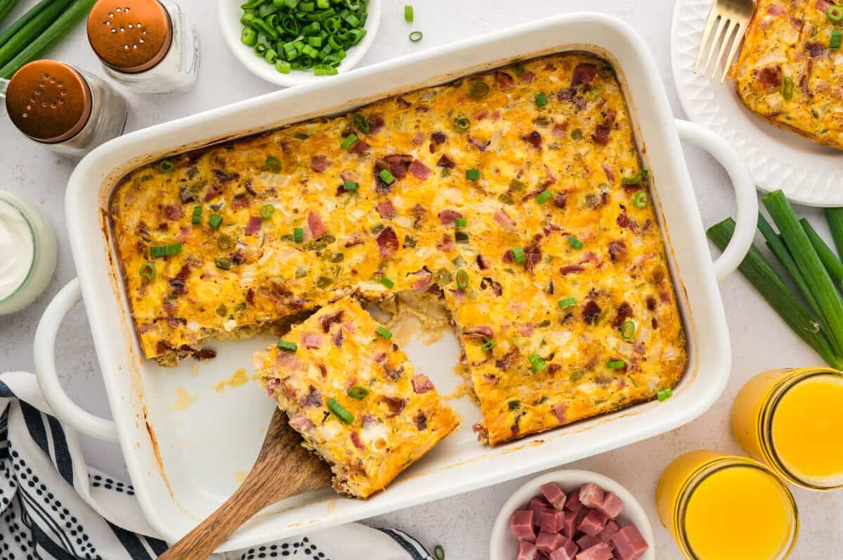 Slices of breakfast casserole in white dish.