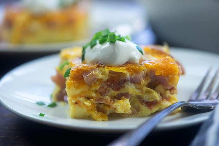 side view of a couple plates of breakfast casserole