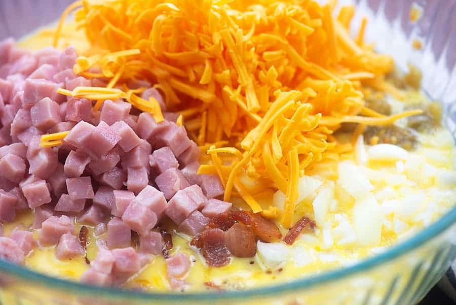 breakfast casserole ingredients in glass bowl