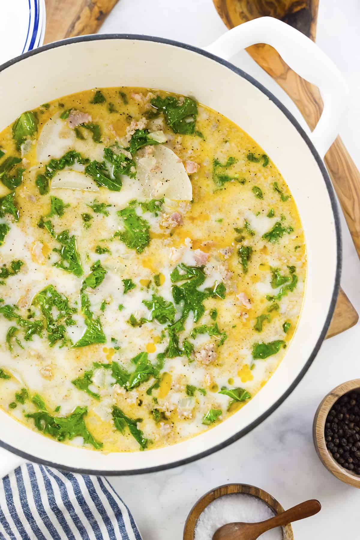 Overhead view of keto zuppa toscana in white dutch oven.