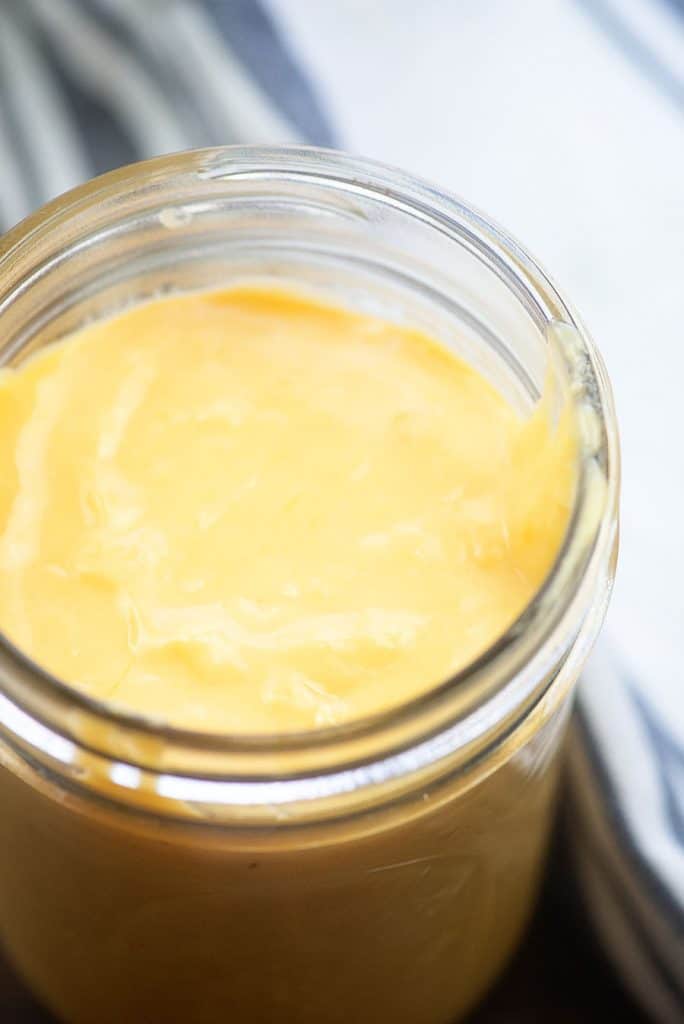 A jar of cheese sauce
