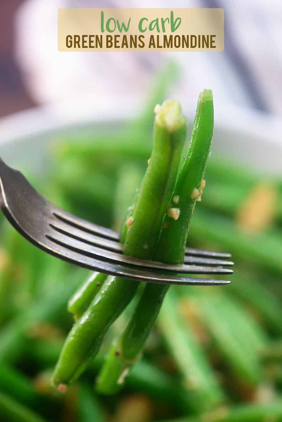 cooked green beans on a fork