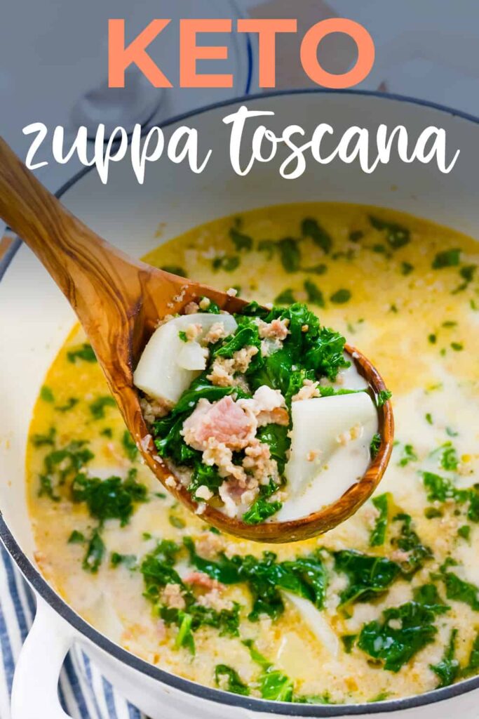 Keto zuppa toscana on wooden spoon over pot of soup.