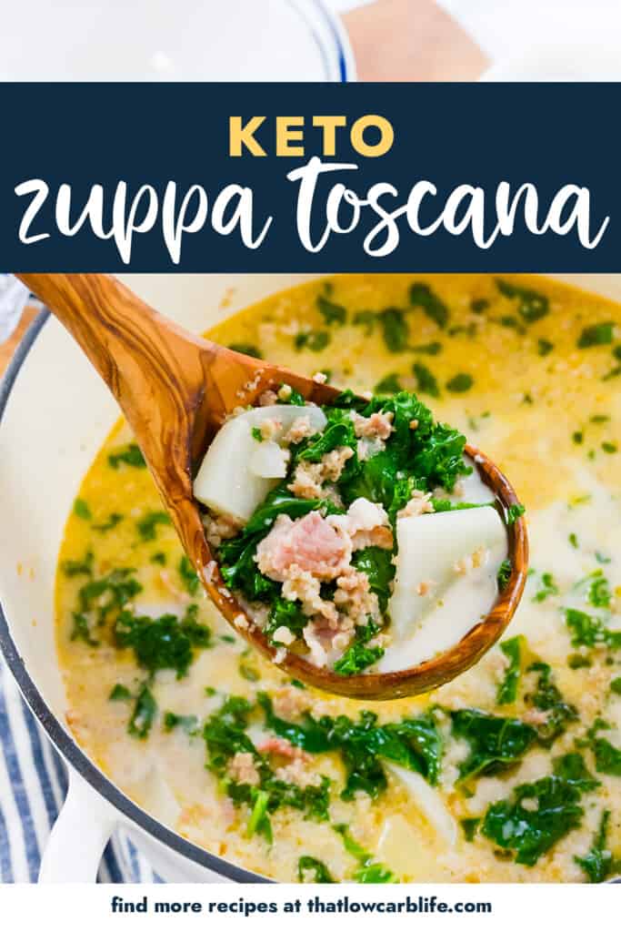 Zuppa toscana on wooden spoon.